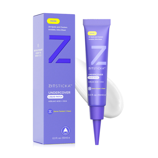 A purple tube of Undercover Liquid Patch for breakout-prone skin stands beside its matching box.