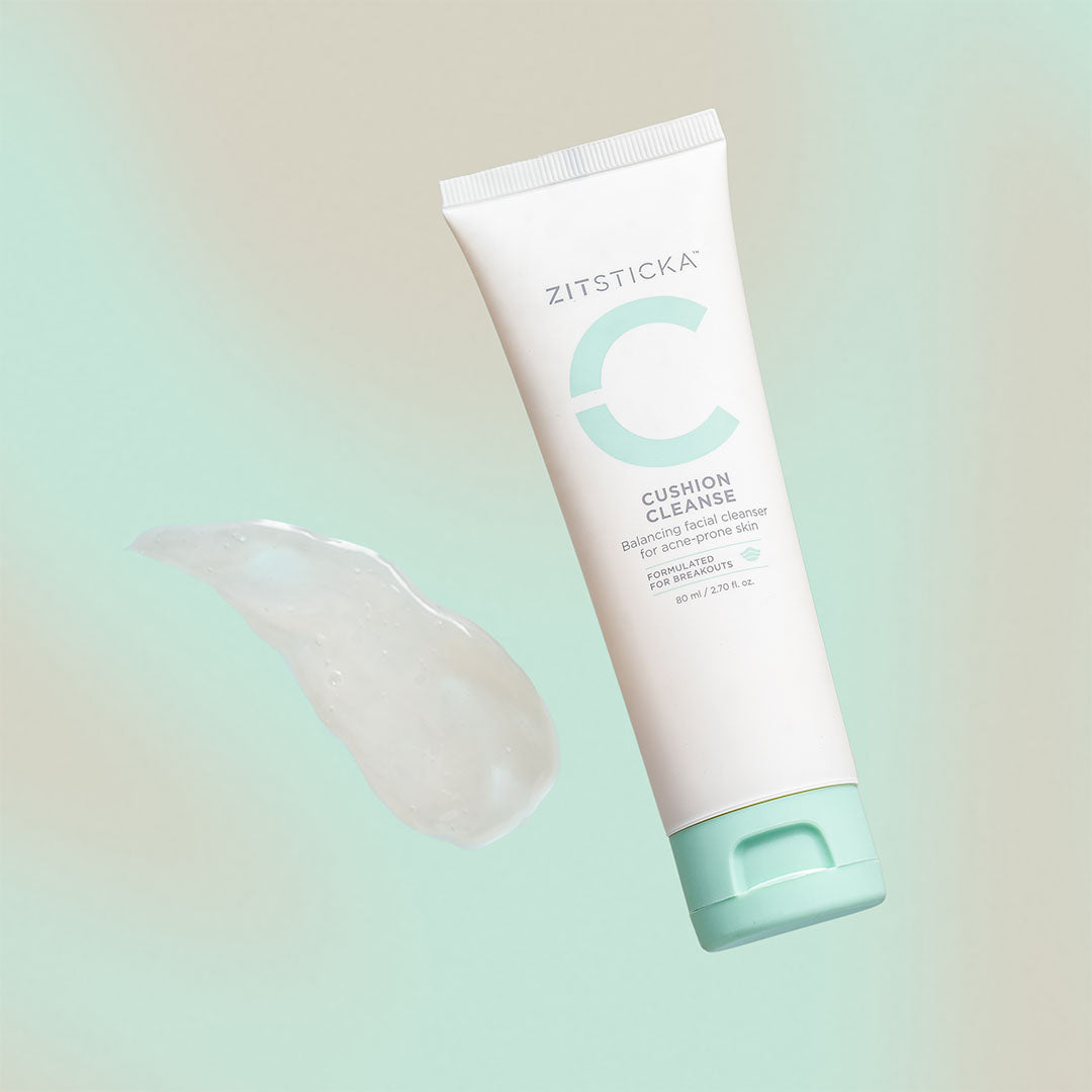 Tube of CUSHION CLEANSE, a gentle gel cleanser for sensitive skin, on a pastel background.
