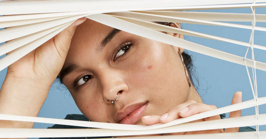 Amber peering out of blinds