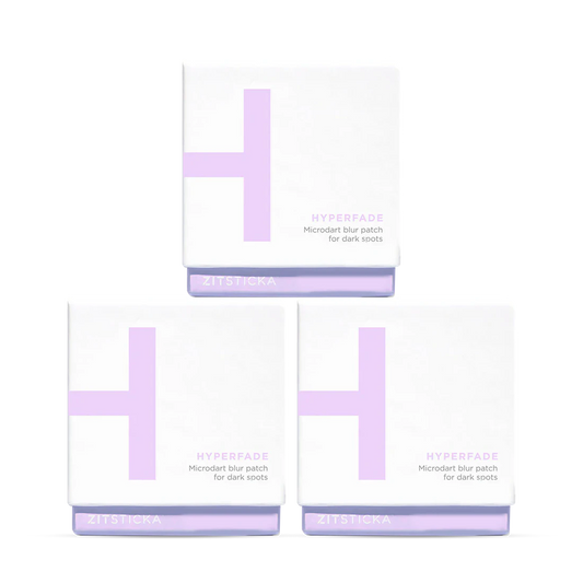 Three HYPERFADE Microdart Blur Patches 12 Pack boxes stacked pyramid-style for clearer-looking skin.