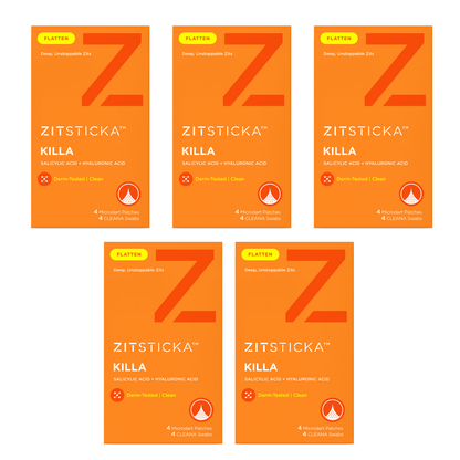 Five orange KILLA Kit pimple patches with microdarts arranged in a grid on a white background.